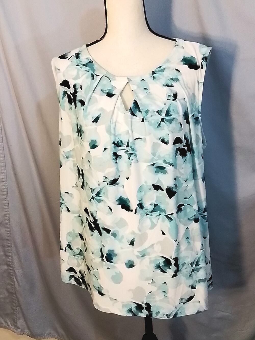 Kasper top with mixed pastels of blues and teal tones.